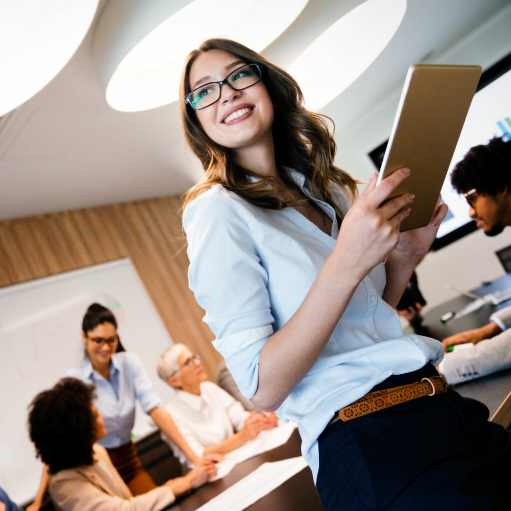 a woman using a tablet during a job meeting